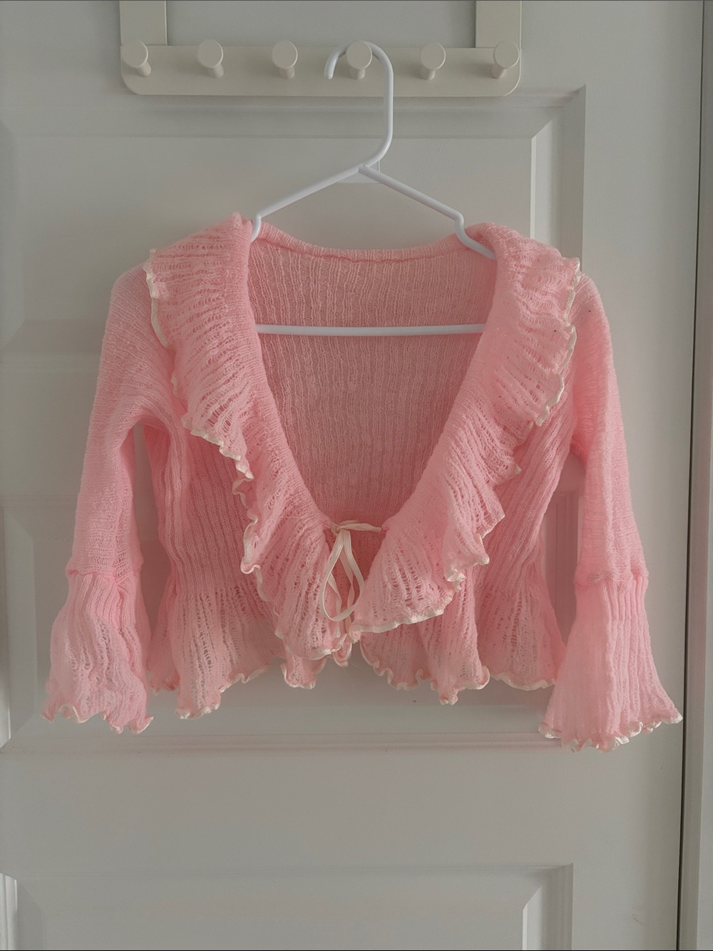 Baby pink knit bolero with tie front